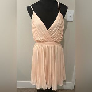 Never worn pretty peachy dress.